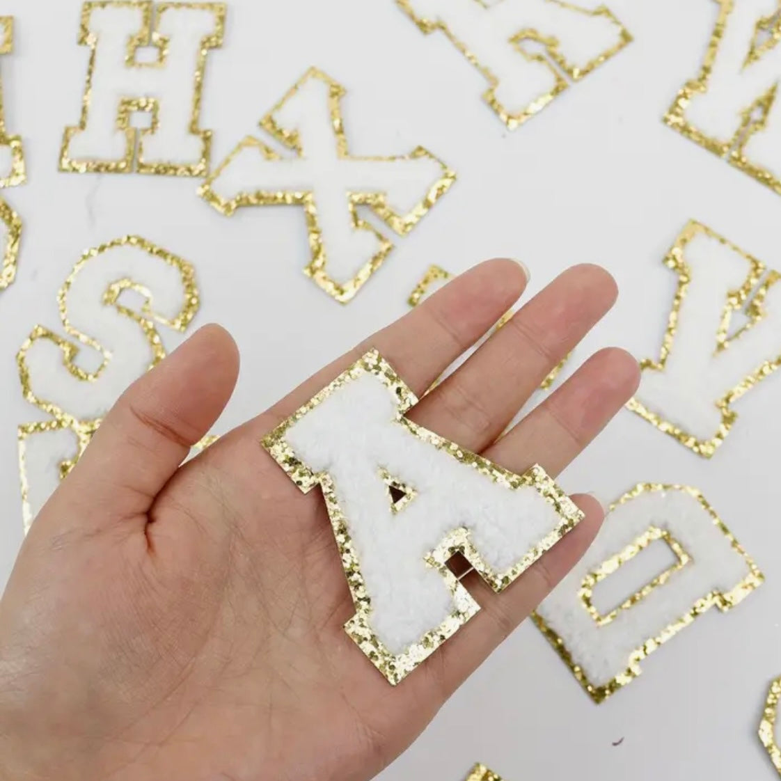 White/Gold Chenille Iron-On letter patches by A-Z alphabet appliques, easily iron on or sew on.